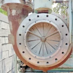 Atlas Copco GT-040-T1K1 centrifugal compressor casing showing the Variable Inlet Guide Vanes (IGV) assembly and inlet flange connection.