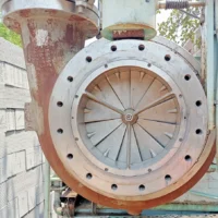 Atlas Copco GT-040-T1K1 centrifugal compressor casing showing the Variable Inlet Guide Vanes (IGV) assembly and inlet flange connection.