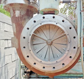 Atlas Copco GT-040-T1K1 Centrifugal Compressor Inlet and IGV Assembly Atlas Copco GT-040-T1K1 centrifugal compressor casing showing the Variable Inlet Guide Vanes (IGV) assembly and inlet flange connection.