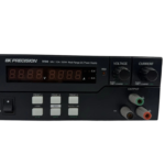 Bottom view of BK Precision 9104 DC power supply featuring serial number barcode label and mounting feet