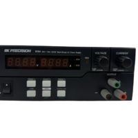Bottom view of BK Precision 9104 DC power supply featuring serial number barcode label and mounting feet