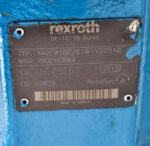 Rexroth AA2FM180/61W-VSD510 motor nameplate showing part number R902193869 and serial number data.