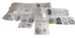 Sorted and individually bagged replacement parts and maintenance kit components for Clover Tool C54450-51 fluid end pump spares arranged against a black background.