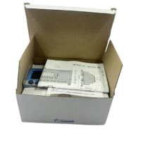 Unboxed new Crouzet XD26 Millenium 3 logic controller 88970161 with official manufacturer instruction manual inside packaging carton