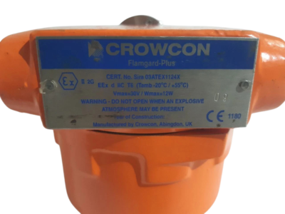 Crowcon Flamgard Plus Exd Nameplate and ATEX Certifications Technical specification nameplate on Crowcon Flamgard Plus orange flameproof enclosure detailing Sira 03ATEX1124X certification, Vmax 30V, and II 2G Ex d rating.