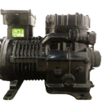 New DWM Copeland D9RC4-1000-AWM/D 10 HP industrial reciprocating compressor side profile highlighting cooling fins and cylinder head assembly