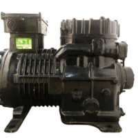 New DWM Copeland D9RC4-1000-AWM/D 10 HP industrial reciprocating compressor side profile highlighting cooling fins and cylinder head assembly