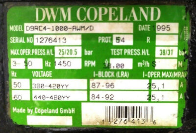 DWM Copeland D9RC4-1000-AWM/D Technical Specification Nameplate Technical nameplate specification label for DWM Copeland D9RC4-1000-AWM/D compressor by Copeland GmbH showing electrical ratings, serial number 1276413, and 38.0 m3/h displacement