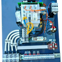 Top-down view of EMRI ASR150 static exciter featuring wiring, capacitors, and heat sink assembly