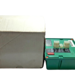 Rear connection base of an Eclipse 5603-32 control module, showing multi-pin edge connectors, a red DIP switch block for TFI timing selection, and an attached technical specifications label next to its shipping box.