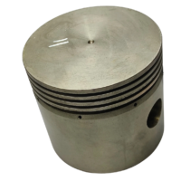 External view of the Gardner Denver 5WAG15 compressor piston showing ring grooves and top surface