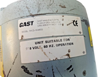 Gast Manufacturing Model 5HCD-10-M533 Identification Label Detailed shot of the Gast Manufacturing IDEX Corporation model identification label verifying model number 5HCD-10-M553 and 60 Hz operation compliance.
