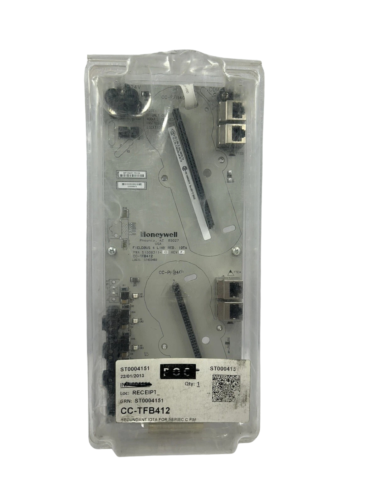 Honeywell CC-TFB412 Honeywell CC-TFB412 Fieldbus 4 Link Redundant IOTA assembly sealed inside protective clear anti-static plastic packaging with a stock tracking barcode sticker.