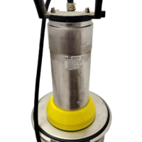 Front view of KSB AMA-Drainer A 422 SD/35 submersible pump featuring a vertical stainless steel motor housing wrapper, a bright yellow clamp ring, and a rugged black top carrying handle against a black background.