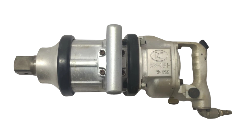 Kuken KW-45F Straight Impact Wrench Full profile view of Kuken KW-45F 1-1/2 inch drive industrial straight air impact wrench featuring aluminum housing, side support handle, rubber protective bumpers, and dynamic air inlet.