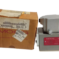 MOOG D631K 294FK servo control valve next to its original manufacturer box packaging