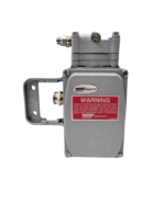 Front view of Masoneilan Dresser 8012-4C electro-pneumatic positioner with red safety warning label and housing
