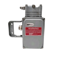 Front view of Masoneilan Dresser 8012-4C electro-pneumatic positioner with red safety warning label and housing