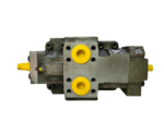 Rear port layout of the Parker V12-060-MU-SV-S hydraulic motor showing two main fluid ports plugged with bright yellow protective plastic caps.