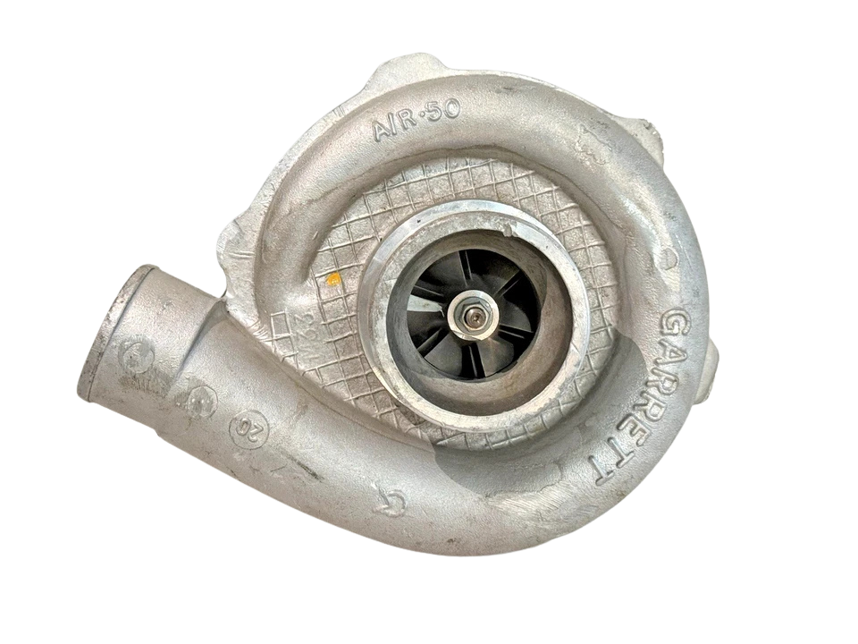 Perkins 2674A080 Turbocharger Front intake view of Garrett TO4E35 turbocharger for Perkins 1006-6T engine highlighting the cast aluminum Garrett compressor housing, A/R .50 markings, and internal compressor wheel blades.