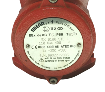 Sirena EX 0100 STL L Nameplate and ATEX Certification Specifications Technical nameplate of Sirena EX 0100 STL L explosion proof signaling device showing ATEX Ex II 2 GD EEx de IIC T6 IP66 markings, 110Vac 40W electrical rating, and CESI 05 ATEX 043 certification details on a red metal housing.