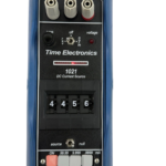Rear label and serial number plate of Time Electronics 1021 DC Current Source calibrator inside protective rubber boot