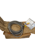 Complete UNISON 9059355-204 flexible turbine ignition lead assembly with right-angle connector head, terminal installation hardware kit, and documentation.