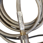 UNISON Industries 9059355-204 explosion proof ignition lead label showing GE P/N and FM certification stamp on stainless steel braided cable.
