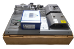 Side view of the reconditioned Wartsila 350753 Oxygen Analyzer module resting on a shipping box, detailing the internal piping, wiring connectors, and hot surface warning shields.