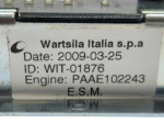 Detailed close-up of Wartsila Italia s.p.a tracking identification label on an ESM Engine Safety Module housing.