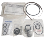 Complete assortment of new Williams Milton Roy P1000V pump repair kits and individual component bags against a black background.
