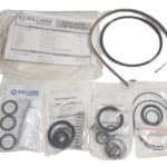 Complete assortment of new Williams Milton Roy P1000V pump repair kits and individual component bags against a black background.
