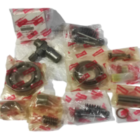 Genuine Yanmar NF60 spare parts kit featuring individual OEM-packaged piston rings, bearings, compression springs, and valve assemblies for emergency starting air compressors.