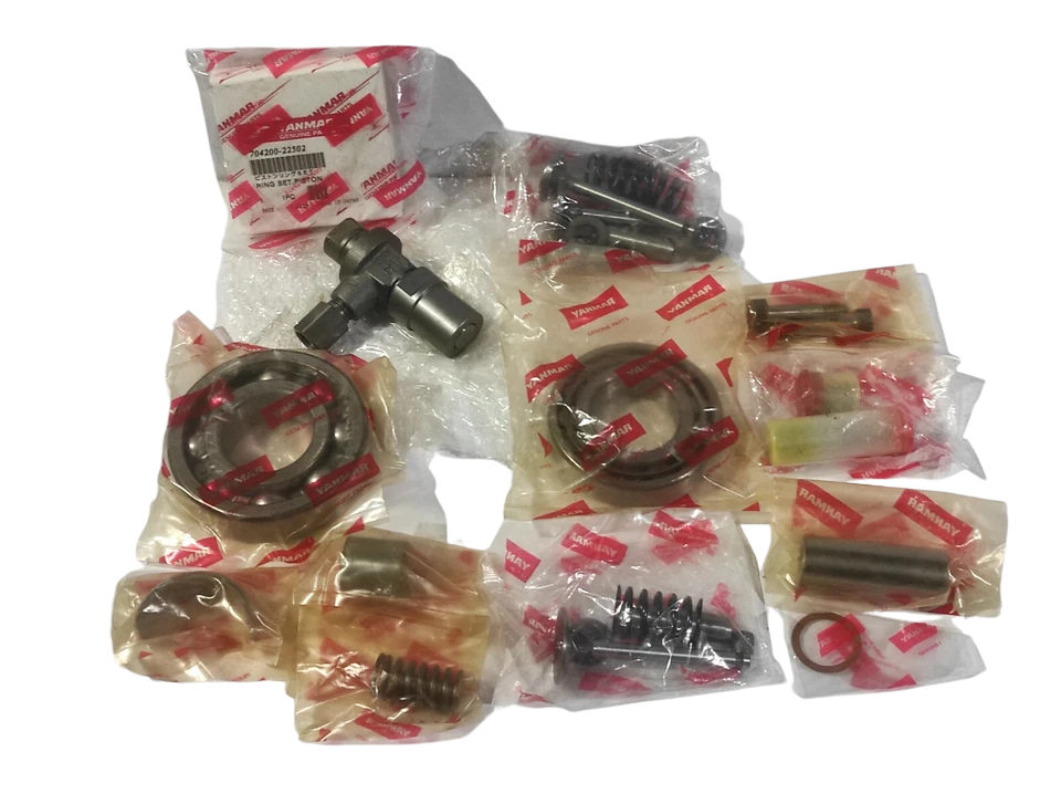 Yanmar NF60 Spare Parts Genuine Yanmar NF60 spare parts kit featuring individual OEM-packaged piston rings, bearings, compression springs, and valve assemblies for emergency starting air compressors.