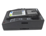Side angle of Dräger X-am 5000 multi-gas monitor docked in 8318639 Lademodul charging cradle