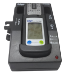 Top-down view of Dräger X-am 5000 gas detector securely seated in 8318639 Lademodul desk charger