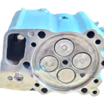Combustion face of an MTU 4000 cylinder head, showing four valves and the fire deck surface.