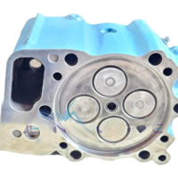 Combustion face of an MTU 4000 cylinder head, showing four valves and the fire deck surface.
