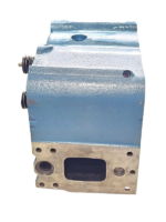 Side view of a blue MTU 4000 cylinder head, highlighting the exhaust manifold mounting port.