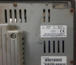 Rear panel of Mitsubishi Electric E1100 HMI 06045C showing communication ports, CF card slot, and 24VDC terminal block