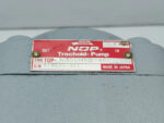 Red nameplate on the NOP Trochoid Pump Type TOP-N350HVB-VF showing specifications.