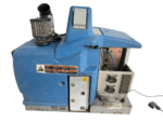 Side view of Nordson Problue L7 adhesive melter showing warning labels and ports