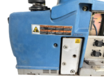 Close-up of warning decals and pneumatic port on Nordson Problue L7