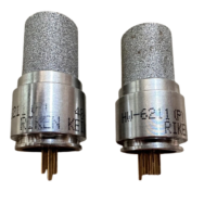 An alternative close-up of Riken Keiki gas sensors with serial numbers and models 4X-0149M P/N:HW-6214(P) clearly visible, highlighting the porous filters and connectors.