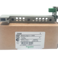Schneider 33095 1600A sensor plug resting on original packaging box