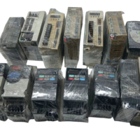 14-piece wholesale lot of wrapped surplus AC variable frequency drives and servo amplifiers for marine and industrial automation.