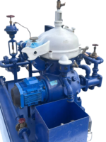 Top-angle view of Alfa Laval MAB 104B-24 separator disc-stack bowl hood, water inlet, and electric drive motor