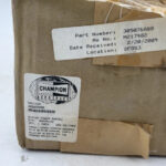 Original packaging box and part label for Champion Aerospace ignition exciter 305076ABB