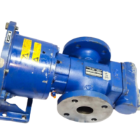 Angled view of unused new IMO ACP 045K7 NVBP triple screw pump with safety warning labels intact.