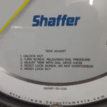 Close-up of Shaffer DD567-32-CGV dial tare adjust operating instructions